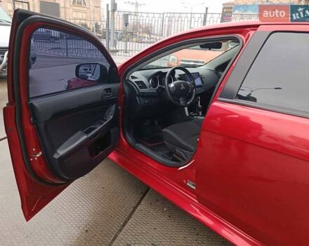 Червоний Міцубісі Lancer, об'ємом двигуна 2 л та пробігом 136 тис. км за 10990 $, фото 13 на Automoto.ua