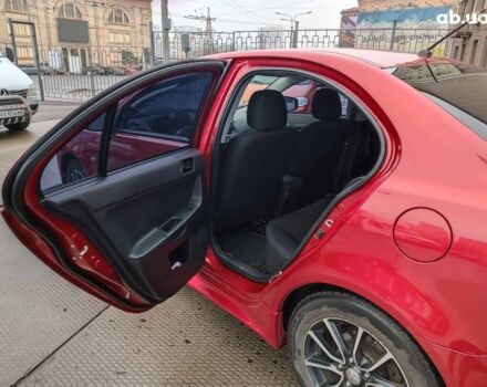 Красный Мицубиси Лансер, объемом двигателя 2 л и пробегом 136 тыс. км за 10990 $, фото 12 на Automoto.ua