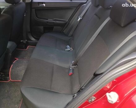 Красный Мицубиси Лансер, объемом двигателя 2 л и пробегом 136 тыс. км за 10990 $, фото 11 на Automoto.ua