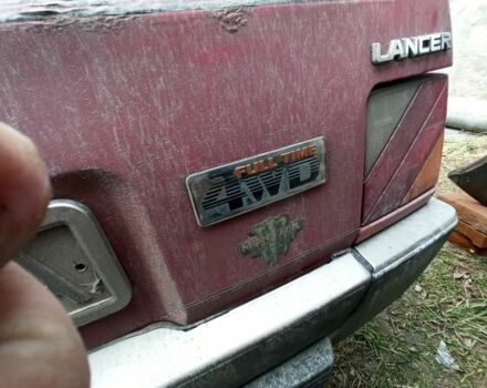 Красный Мицубиси Лансер, объемом двигателя 1.8 л и пробегом 250 тыс. км за 700 $, фото 4 на Automoto.ua