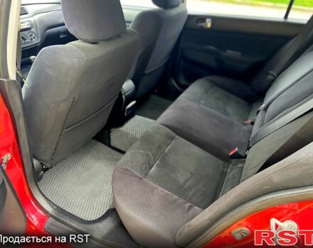 Красный Мицубиси Лансер, объемом двигателя 1.6 л и пробегом 214 тыс. км за 3999 $, фото 7 на Automoto.ua