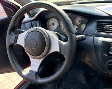 Червоний Міцубісі Lancer, об'ємом двигуна 1.6 л та пробігом 205 тис. км за 4400 $, фото 1 на Automoto.ua