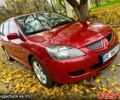 Красный Мицубиси Лансер, объемом двигателя 1.6 л и пробегом 214 тыс. км за 3999 $, фото 2 на Automoto.ua