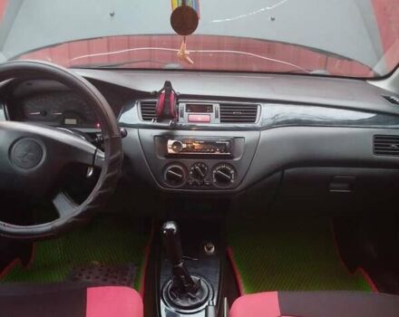 Красный Мицубиси Лансер, объемом двигателя 1.6 л и пробегом 260 тыс. км за 3000 $, фото 5 на Automoto.ua