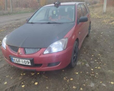 Красный Мицубиси Лансер, объемом двигателя 1.6 л и пробегом 260 тыс. км за 3000 $, фото 3 на Automoto.ua