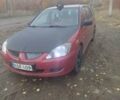 Красный Мицубиси Лансер, объемом двигателя 1.6 л и пробегом 260 тыс. км за 3000 $, фото 3 на Automoto.ua