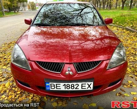 Красный Мицубиси Лансер, объемом двигателя 1.6 л и пробегом 214 тыс. км за 3999 $, фото 1 на Automoto.ua