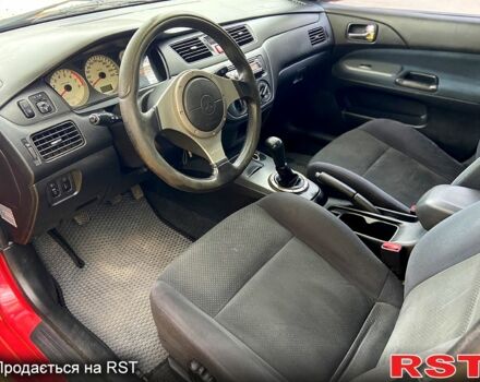 Красный Мицубиси Лансер, объемом двигателя 1.6 л и пробегом 214 тыс. км за 3999 $, фото 6 на Automoto.ua