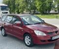 Красный Мицубиси Лансер, объемом двигателя 1.6 л и пробегом 323 тыс. км за 1799 $, фото 1 на Automoto.ua