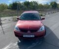 Красный Мицубиси Лансер, объемом двигателя 1.6 л и пробегом 333 тыс. км за 2950 $, фото 1 на Automoto.ua