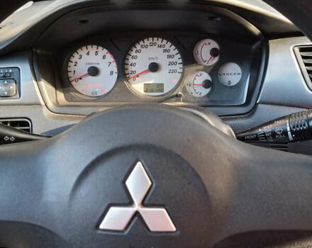 Красный Мицубиси Лансер, объемом двигателя 1.6 л и пробегом 217 тыс. км за 3750 $, фото 4 на Automoto.ua