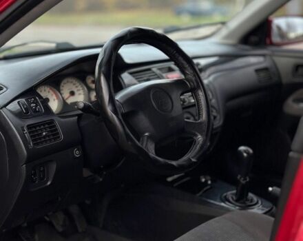 Красный Мицубиси Лансер, объемом двигателя 1.6 л и пробегом 290 тыс. км за 2800 $, фото 4 на Automoto.ua