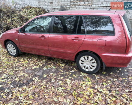 Красный Мицубиси Лансер, объемом двигателя 1.6 л и пробегом 217 тыс. км за 3750 $, фото 1 на Automoto.ua