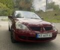Красный Мицубиси Лансер, объемом двигателя 1.6 л и пробегом 245 тыс. км за 4300 $, фото 1 на Automoto.ua