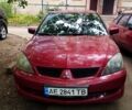 Красный Мицубиси Лансер, объемом двигателя 1.6 л и пробегом 225 тыс. км за 2500 $, фото 1 на Automoto.ua