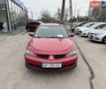 Красный Мицубиси Лансер, объемом двигателя 1.58 л и пробегом 298 тыс. км за 3999 $, фото 1 на Automoto.ua