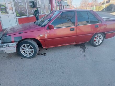 Красный Мицубиси Лансер, объемом двигателя 1.5 л и пробегом 222 тыс. км за 700 $, фото 1 на Automoto.ua