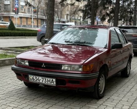 Красный Мицубиси Лансер, объемом двигателя 1.5 л и пробегом 270 тыс. км за 950 $, фото 1 на Automoto.ua