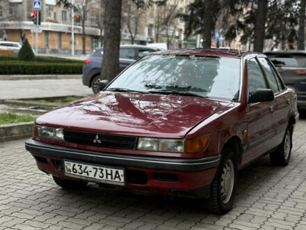 Красный Мицубиси Лансер, объемом двигателя 1.5 л и пробегом 270 тыс. км за 950 $, фото 1 на Automoto.ua