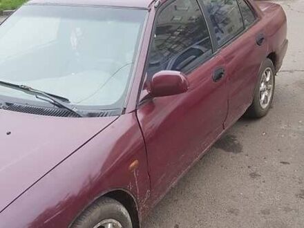 Красный Мицубиси Лансер, объемом двигателя 1.6 л и пробегом 362 тыс. км за 1700 $, фото 1 на Automoto.ua