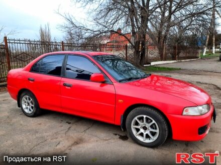 Красный Мицубиси Лансер, объемом двигателя 1.3 л и пробегом 409 тыс. км за 2000 $, фото 1 на Automoto.ua
