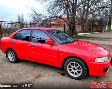 Красный Мицубиси Лансер, объемом двигателя 1.3 л и пробегом 409 тыс. км за 2000 $, фото 1 на Automoto.ua