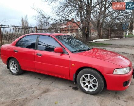 Красный Мицубиси Лансер, объемом двигателя 1.3 л и пробегом 409 тыс. км за 2000 $, фото 1 на Automoto.ua