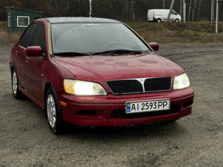 Червоний Міцубісі Lancer, об'ємом двигуна 2 л та пробігом 202 тис. км за 2599 $, фото 1 на Automoto.ua