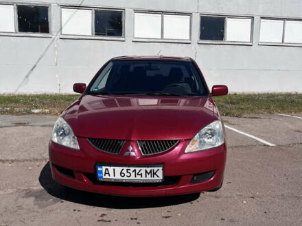 Мицубиси Лансер 2003 в Чернигове на Automoto.ua Красный Мицубиси Лансер, объемом двигателя 1.58 л и пробегом 300 тыс. км за 3200 $, фото 1 на Automoto.ua