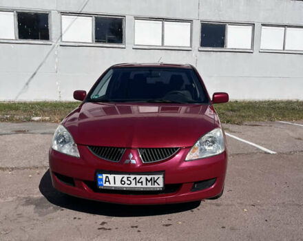 Красный Мицубиси Лансер, объемом двигателя 1.58 л и пробегом 300 тыс. км за 3200 $, фото 1 на Automoto.ua