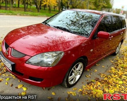 Красный Мицубиси Лансер, объемом двигателя 1.6 л и пробегом 214 тыс. км за 3999 $, фото 1 на Automoto.ua