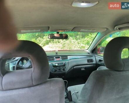 Красный Мицубиси Лансер, объемом двигателя 1.6 л и пробегом 400 тыс. км за 3100 $, фото 1 на Automoto.ua