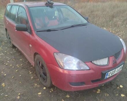 Красный Мицубиси Лансер, объемом двигателя 1.6 л и пробегом 260 тыс. км за 3000 $, фото 1 на Automoto.ua