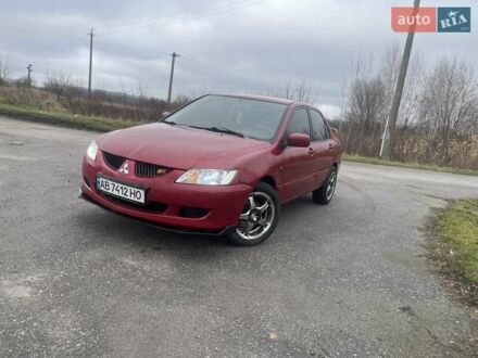Красный Мицубиси Лансер, объемом двигателя 1.3 л и пробегом 250 тыс. км за 3450 $, фото 1 на Automoto.ua