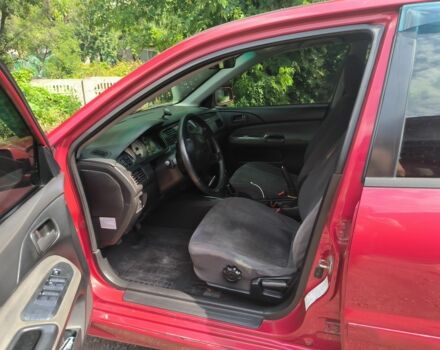 Красный Мицубиси Лансер, объемом двигателя 1.6 л и пробегом 400 тыс. км за 3100 $, фото 1 на Automoto.ua