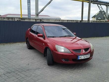 Червоний Міцубісі Lancer, об'ємом двигуна 1.6 л та пробігом 211 тис. км за 4200 $, фото 1 на Automoto.ua