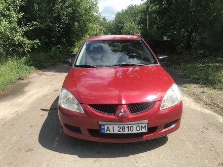 Червоний Міцубісі Lancer, об'ємом двигуна 1.3 л та пробігом 177 тис. км за 4200 $, фото 1 на Automoto.ua