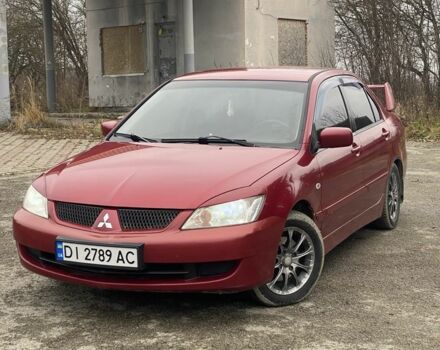 Красный Мицубиси Лансер, объемом двигателя 1.6 л и пробегом 186 тыс. км за 4000 $, фото 1 на Automoto.ua