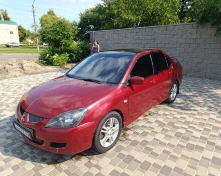 Червоний Міцубісі Lancer, об'ємом двигуна 2 л та пробігом 299 тис. км за 3400 $, фото 1 на Automoto.ua