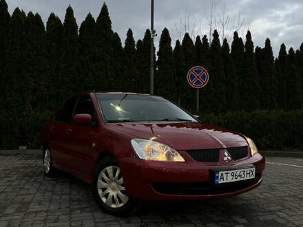 Красный Мицубиси Лансер, объемом двигателя 1.6 л и пробегом 240 тыс. км за 3500 $, фото 1 на Automoto.ua