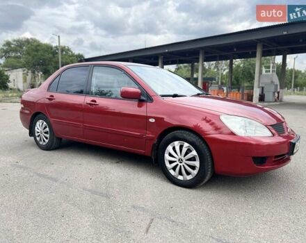 Красный Мицубиси Лансер, объемом двигателя 1.58 л и пробегом 250 тыс. км за 3999 $, фото 1 на Automoto.ua