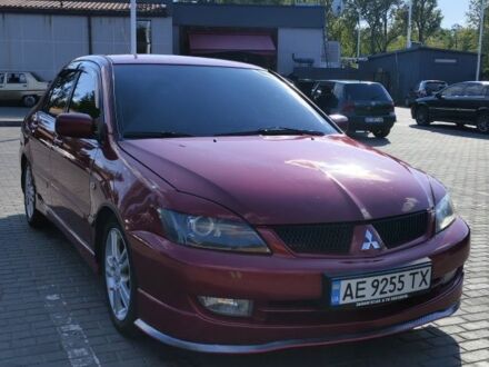Мицубиси Лансер 2006 в Днепре (Днепропетровске) на Automoto.ua Красный Мицубиси Лансер, объемом двигателя 2 л и пробегом 251 тыс. км за 6500 $, фото 1 на Automoto.ua