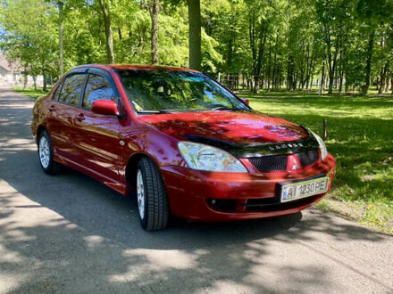 Червоний Міцубісі Lancer, об'ємом двигуна 1.6 л та пробігом 162 тис. км за 5400 $, фото 1 на Automoto.ua