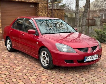 Красный Мицубиси Лансер, объемом двигателя 1.6 л и пробегом 239 тыс. км за 4100 $, фото 1 на Automoto.ua