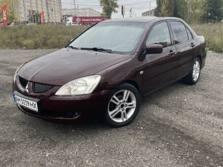 Червоний Міцубісі Lancer, об'ємом двигуна 2 л та пробігом 295 тис. км за 4150 $, фото 1 на Automoto.ua