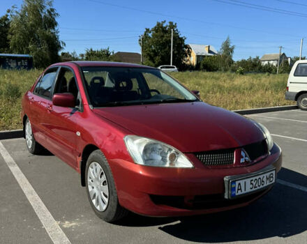 Червоний Міцубісі Lancer, об'ємом двигуна 1.58 л та пробігом 237 тис. км за 3100 $, фото 1 на Automoto.ua
