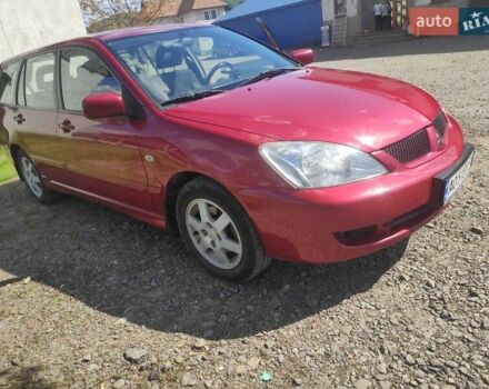 Красный Мицубиси Лансер, объемом двигателя 1.58 л и пробегом 210 тыс. км за 3300 $, фото 1 на Automoto.ua