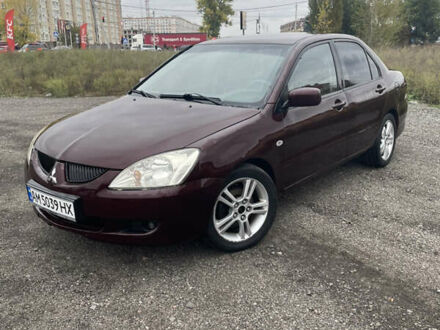 Красный Мицубиси Лансер, объемом двигателя 2 л и пробегом 295 тыс. км за 4150 $, фото 1 на Automoto.ua