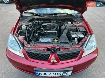Червоний Міцубісі Lancer, об'ємом двигуна 1.58 л та пробігом 273 тис. км за 3500 $, фото 1 на Automoto.ua
