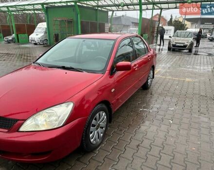 Червоний Міцубісі Lancer, об'ємом двигуна 1.6 л та пробігом 185 тис. км за 5000 $, фото 1 на Automoto.ua